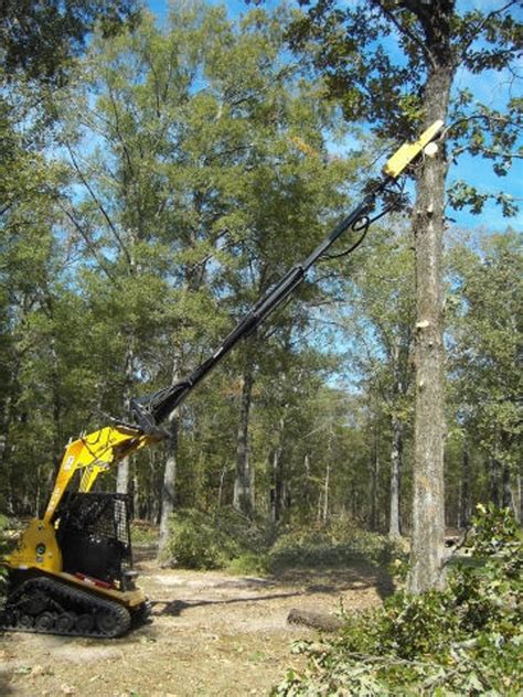 pole saw attachment for skid steer|skid steer tree trimming attachment.